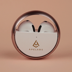 TWS Earbuds with an ergonomic design and a metallic finish, placed inside a black charging case with the APELABS logo on the front.
